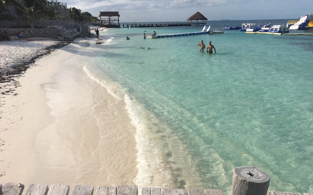 beach with crystal clear water in cancun mexico
