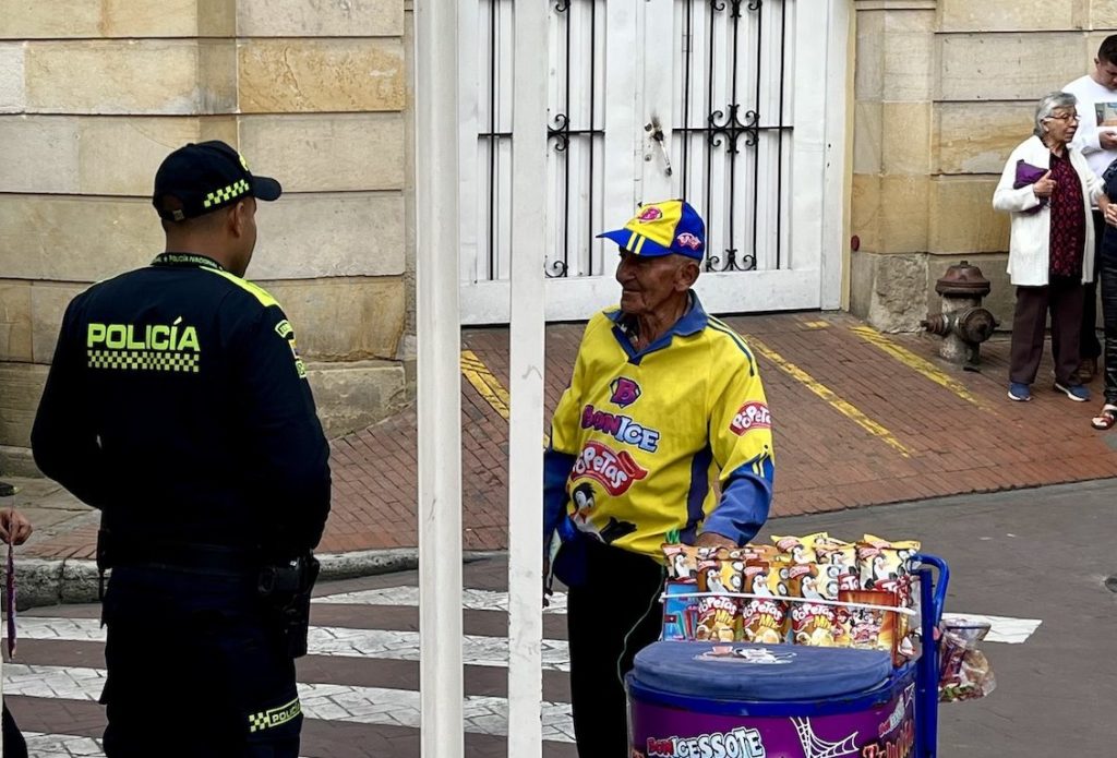 Elderly vendor talks to police in Colombia